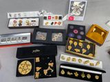 many different types of jewelry on display on a table