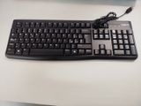 a black keyboard and mouse on a white desk
