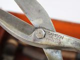 a close up of a pair of scissors on a table