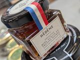 a jar of honey sitting on top of a table