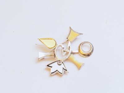 two rings and a pair of scissors on a white surface