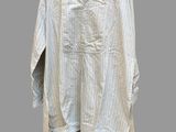 an image of a white shirt hanging on a wooden hanger