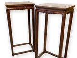 pair of wooden side tables on a white background with a white background