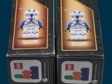 two boxes of lego star wars minifigurts on display