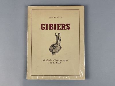 un vieux livre dont la couverture est ornée d'une image de lapin