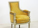 an image of a yellow chair in a room with a white wall