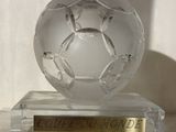 a crystal ball sitting on top of a gold plate