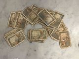 a pile of old money sitting on a table