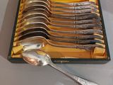 a lot of spoons in a box on the table