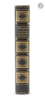 an old black book with gold trimmings and gold trimmings