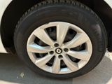 a close up of a tire on a white car