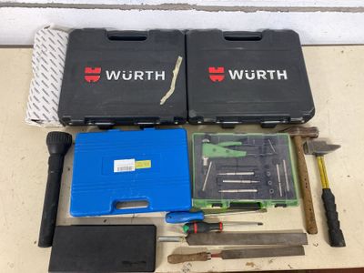 many tools that are laying out on the table