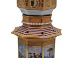 a decorative clock that is sitting on top of a table