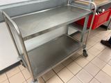 a metal cart with a handle on it in a kitchen