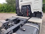 a truck that has a bunch of items in the back of it