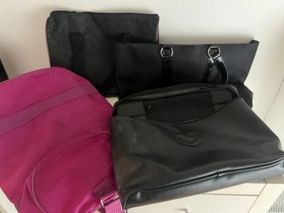 three pieces of luggage sitting on top of a table next to each other