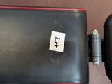 a sticker on the seat of a black and red chair