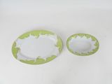 two plates that are sitting on a white table