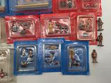 a lot of toy figurines that are on the table