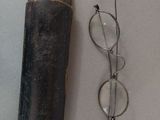 a pair of glasses and a pair of eyeglasses on a table