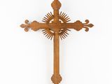 a wooden cross with a sunburst on it against a white background