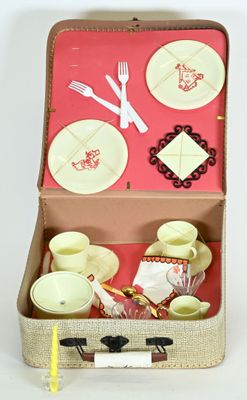 a suitcase with a set of dishes and utensils in it