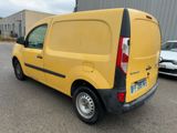 the back of a yellow van parked in a parking lot