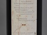 a label on a bottle of wine on a table