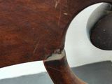 a close up of a wooden object on a chair