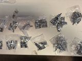 a lot of screws and bolts on the table