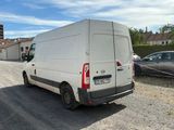 a white van that is parked on the side of the road