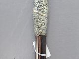 a close up of a cane with a design on it