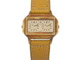 une photo d'une montre-bracelet au cadran carré et au bracelet en cuir marron