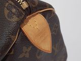 a close up view of a louis vuitton bag