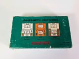 an old green box with a picture of a kitchen on it