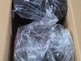 a cardboard box filled with a bunch of plastic items