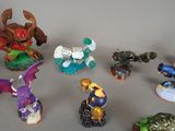 many figurines of different types and sizes on the table
