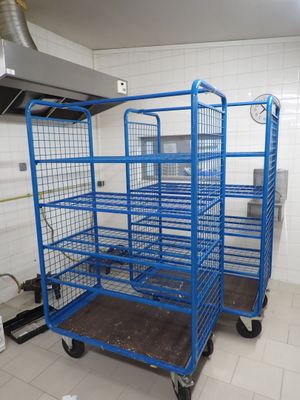 a blue cart in the middle of a kitchen