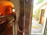 doorway leading to a kitchen with an oven and a sink in it