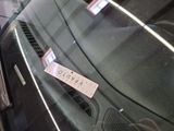 a sticker on the windshield of a car with a name on it