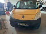 a small yellow van that is parked in a garage