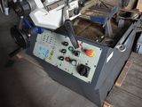 a machine that is sitting on a pallet in a warehouse