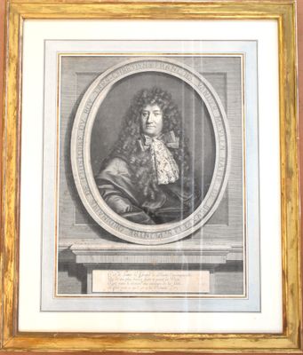 un vieux portrait gravé représentant un homme, dans un cadre doré
