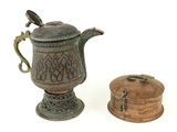 a small metal tea pot and a small wooden box