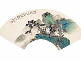 an oriental fan with a painting of mountains and trees on it