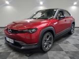 the red mazda cx - hr suv is parked on a checkered floor
