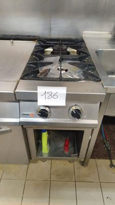 a stainless steel stove and sink in a kitchen