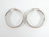 pair of silver hoop earrings on a white background