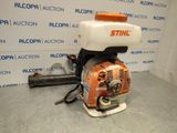 an orange and white blower sitting on top of a table