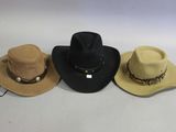three hats are lined up on a white surface